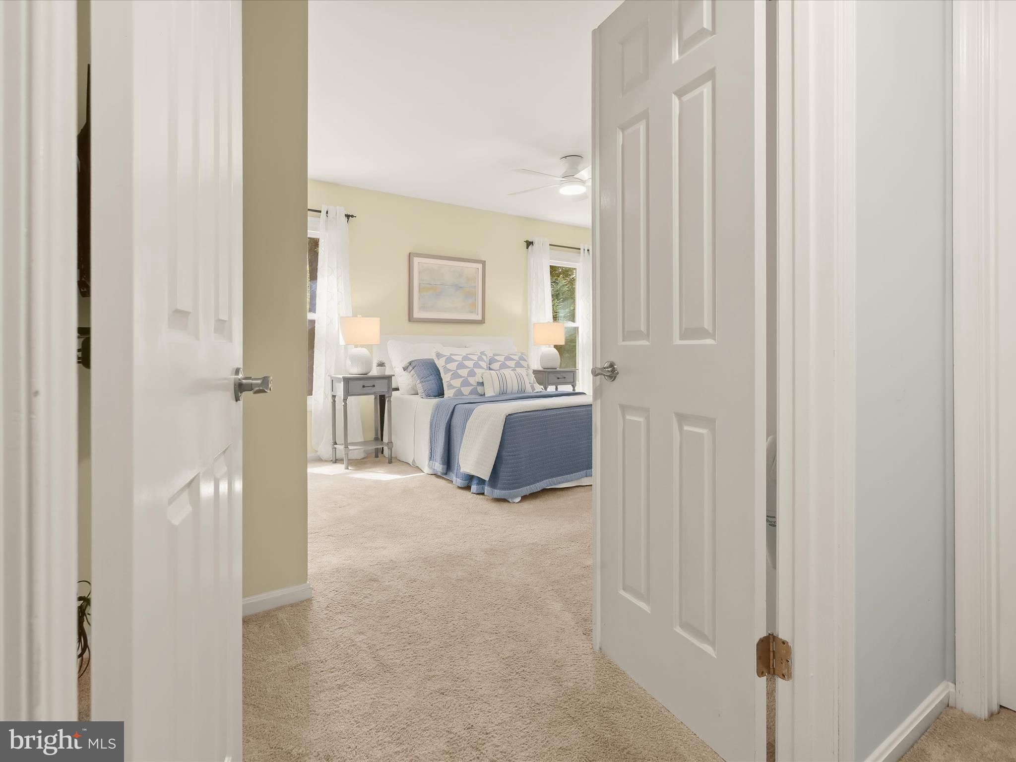 303 Riding Ridge Road Annapolis, MD 21403 - Photo 16 of 43 a view of a bedroom with a bed and a cabinet