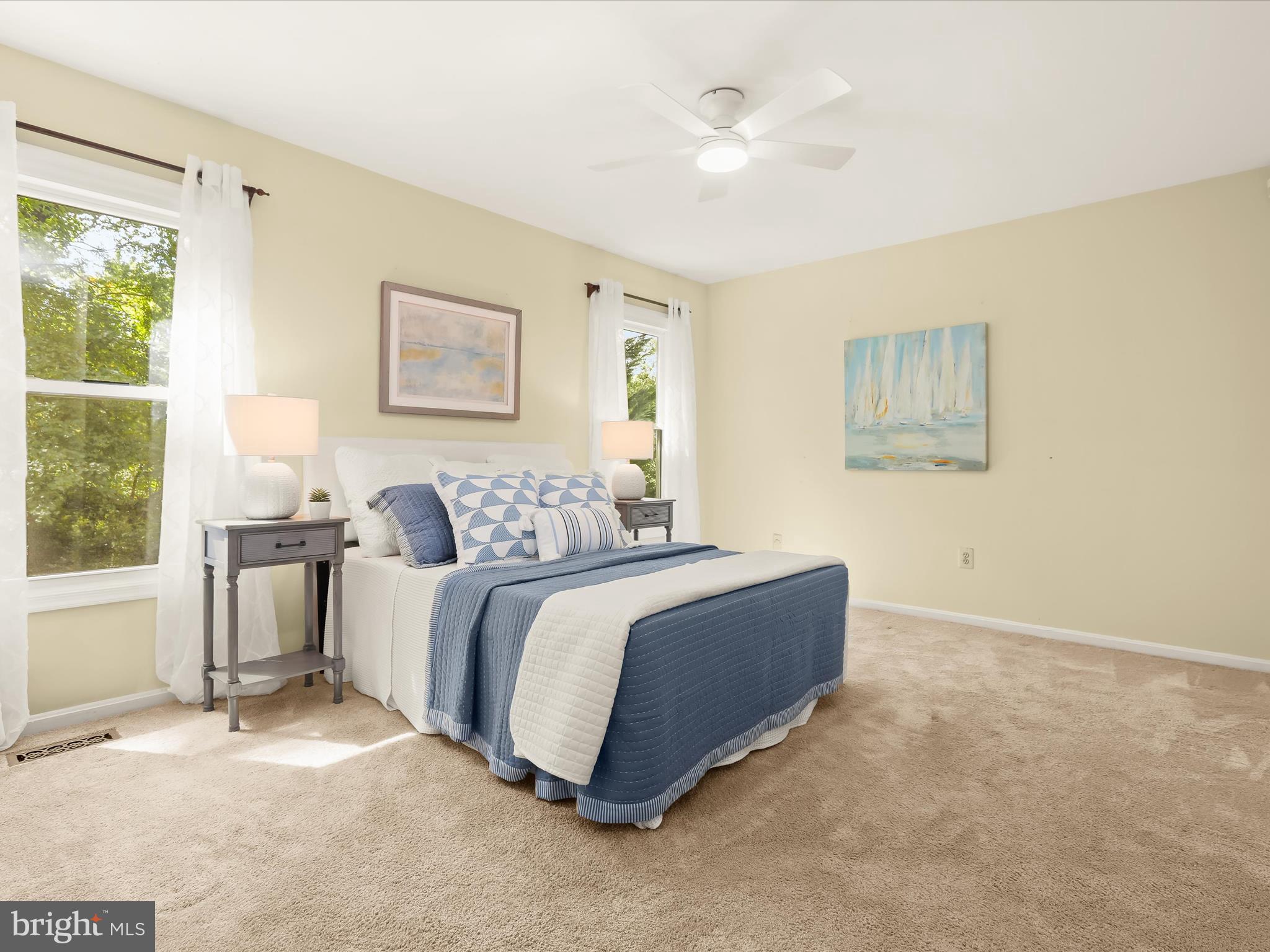 303 Riding Ridge Road Annapolis, MD 21403 - Photo 17 of 43 a spacious bedroom with a bed and a window