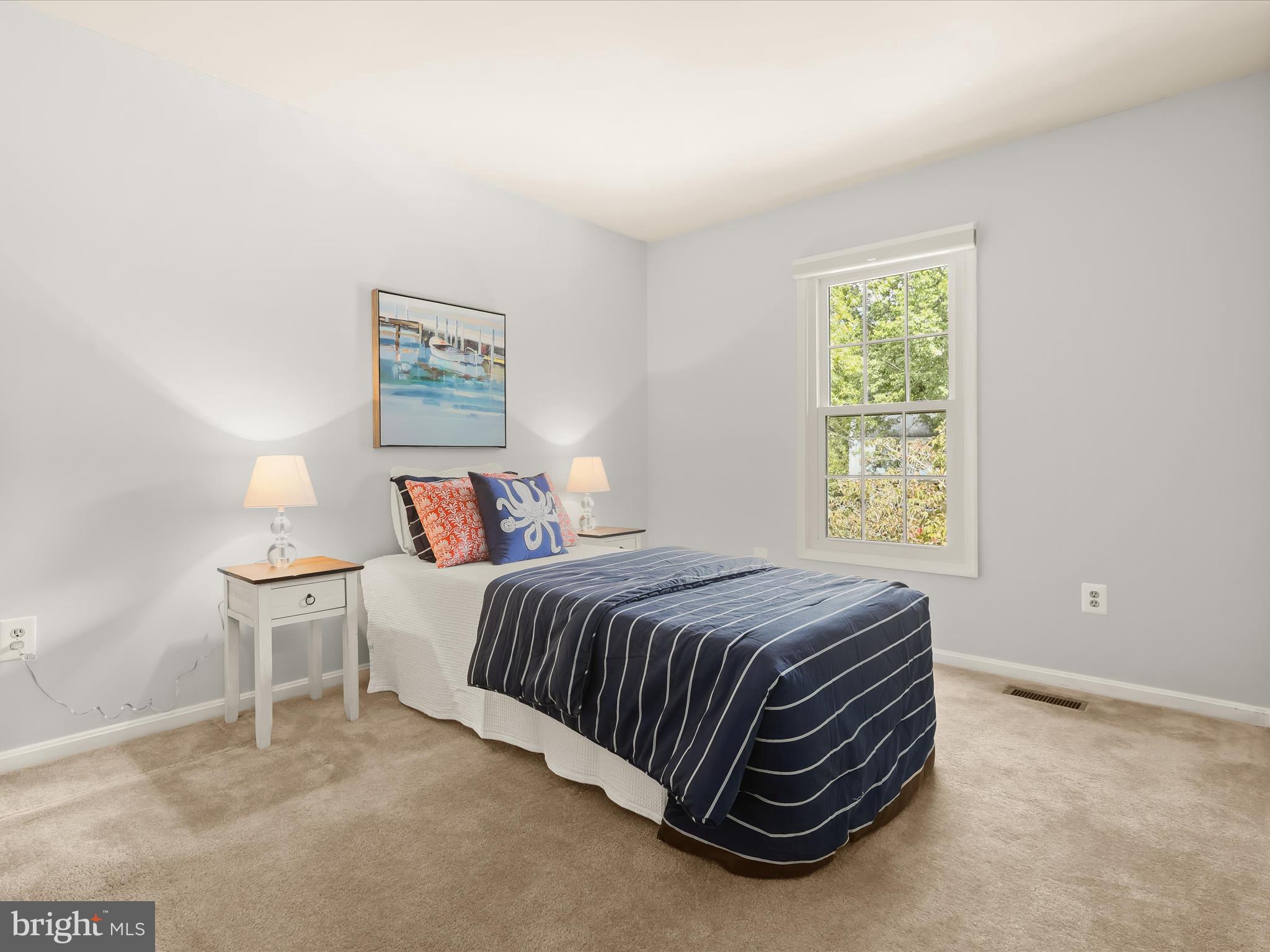 303 Riding Ridge Road Annapolis, MD 21403 - Photo 20 of 43 a bedroom with a bed and a window