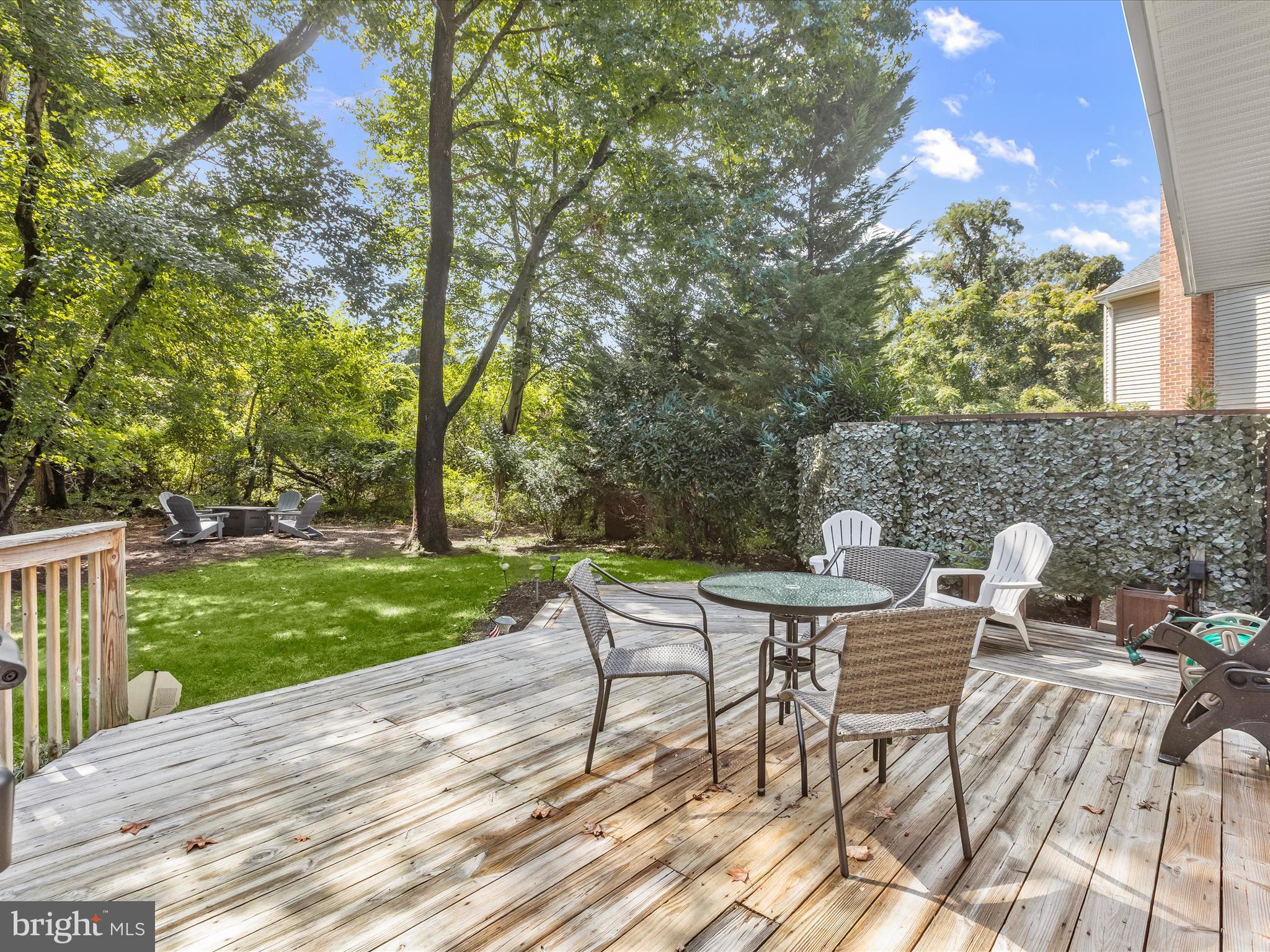 303 Riding Ridge Road Annapolis, MD 21403 - Photo 2 of 43 a view of backyard with seating area and green space