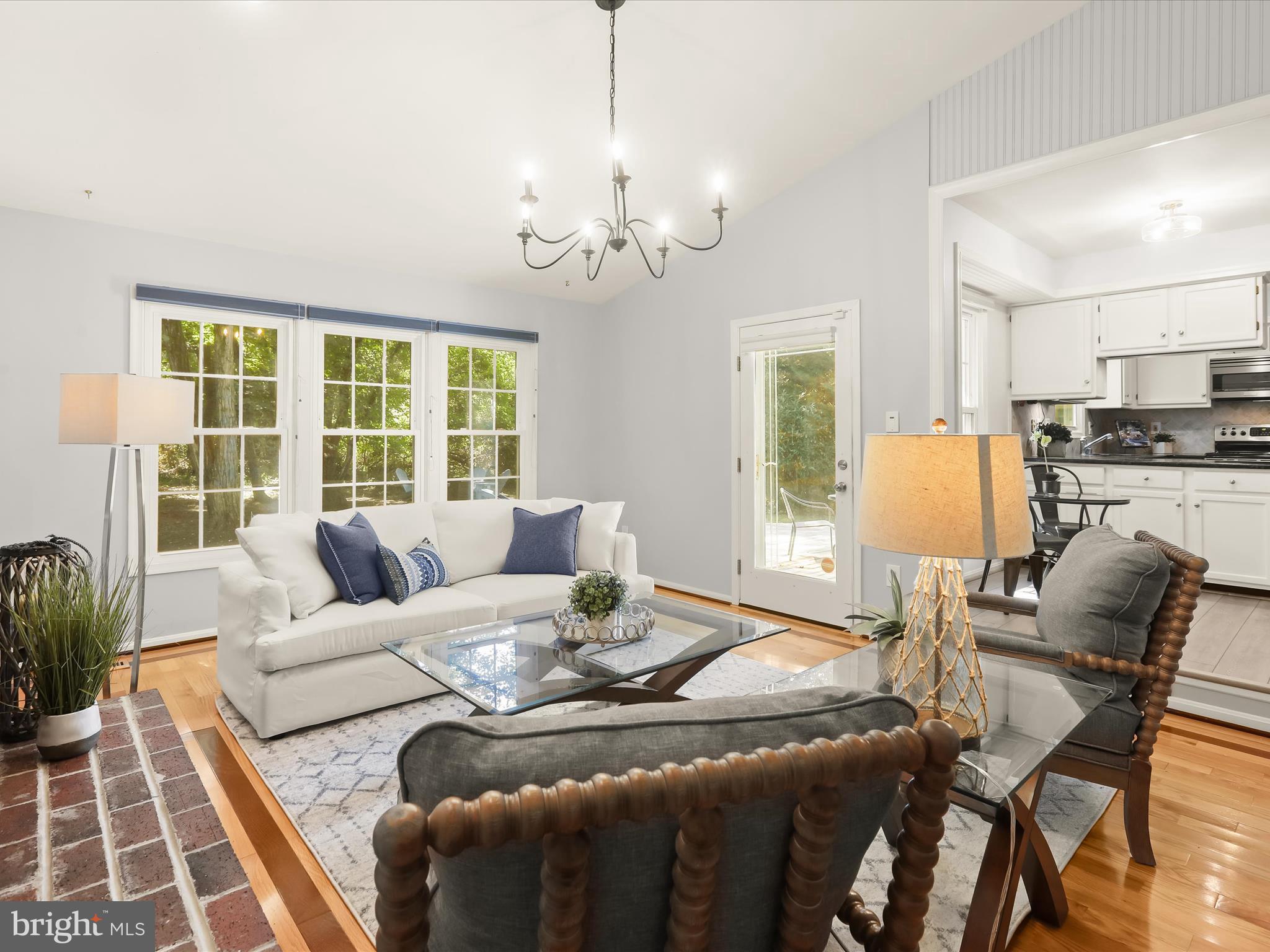 303 Riding Ridge Road Annapolis, MD 21403 - Photo 26 of 43 a living room with furniture and a chandelier