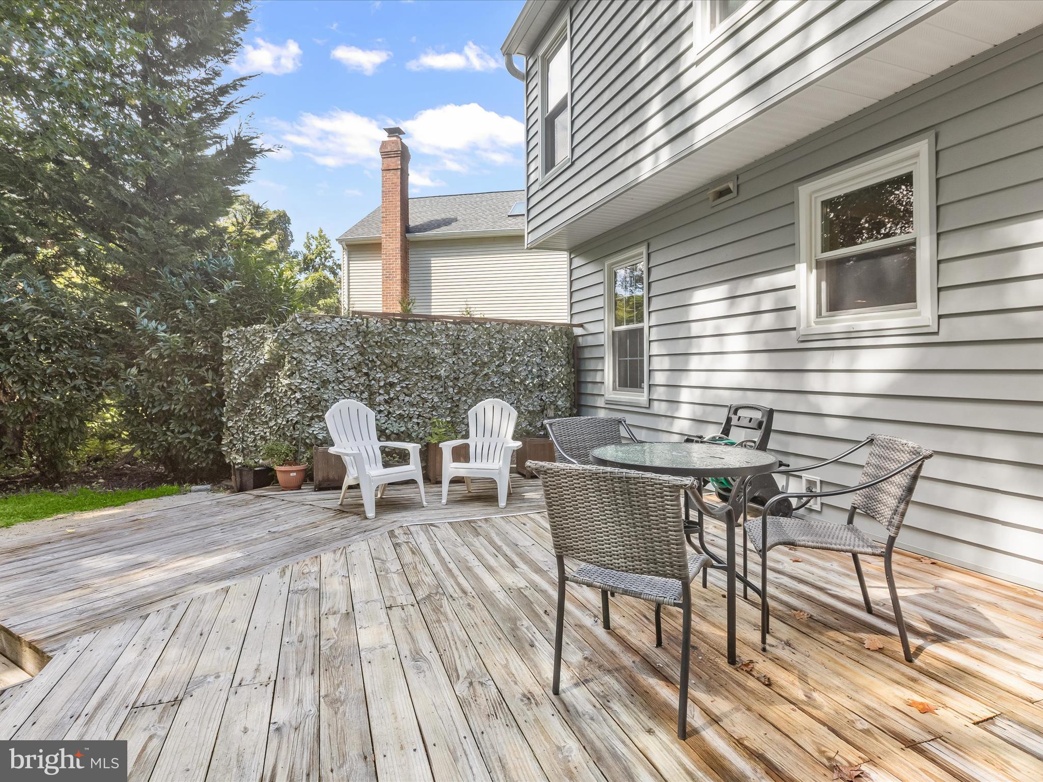 303 Riding Ridge Road Annapolis, MD 21403 - Photo 30 of 43 a roof deck view with table and chairs and wooden floor