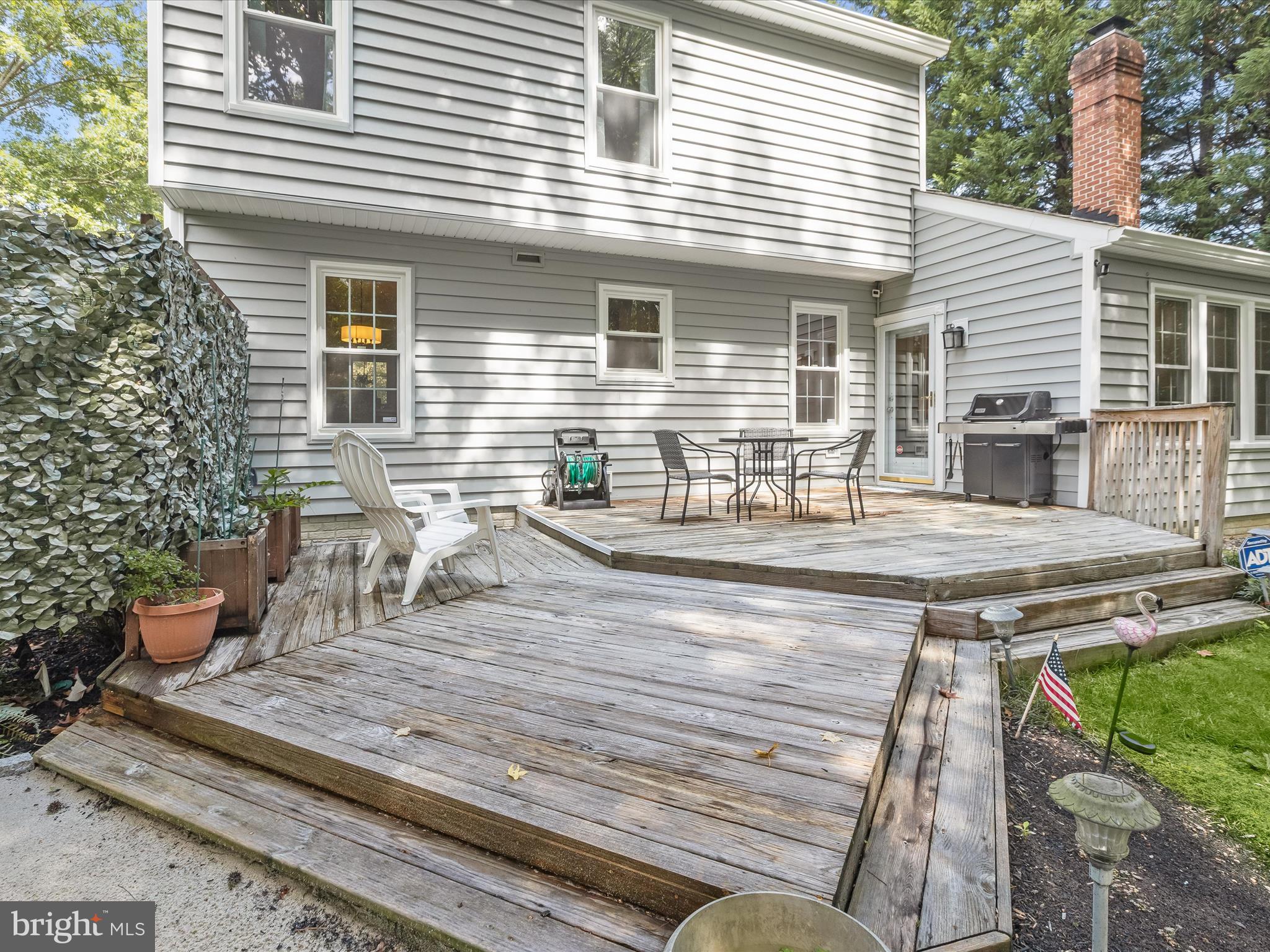 303 Riding Ridge Road Annapolis, MD 21403 - Photo 31 of 43 a view of a chairs and table on the deck