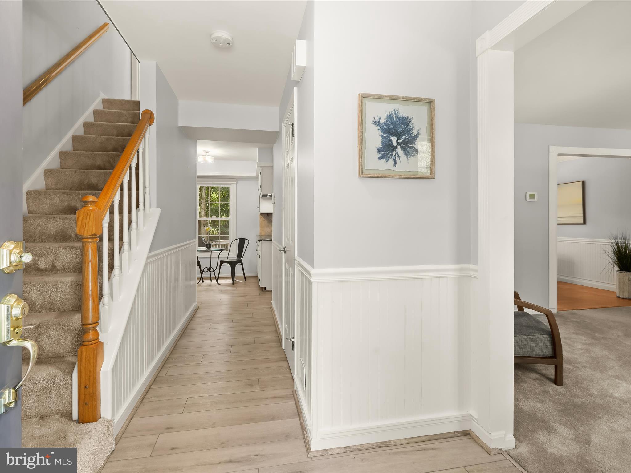 303 Riding Ridge Road Annapolis, MD 21403 - Photo 39 of 43 a view of a hallway with wooden floor and stairs