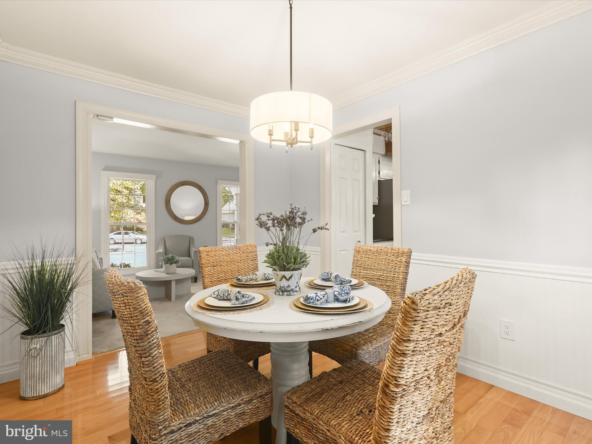 303 Riding Ridge Road Annapolis, MD 21403 - Photo 4 of 43 a view of a dining room with furniture and wooden floor