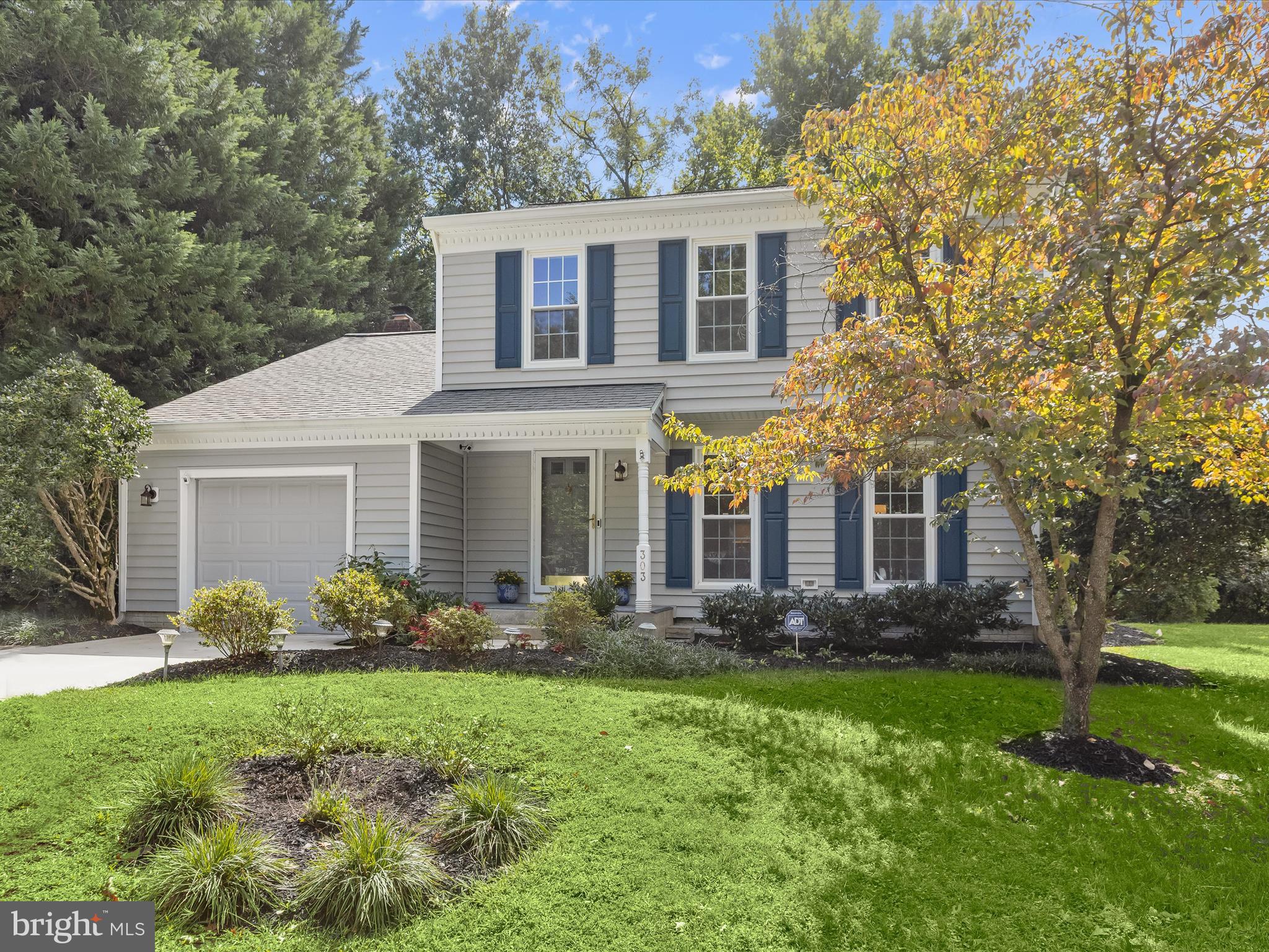 303 Riding Ridge Road Annapolis, MD 21403 - Photo 5 of 43 a front view of a house with garden
