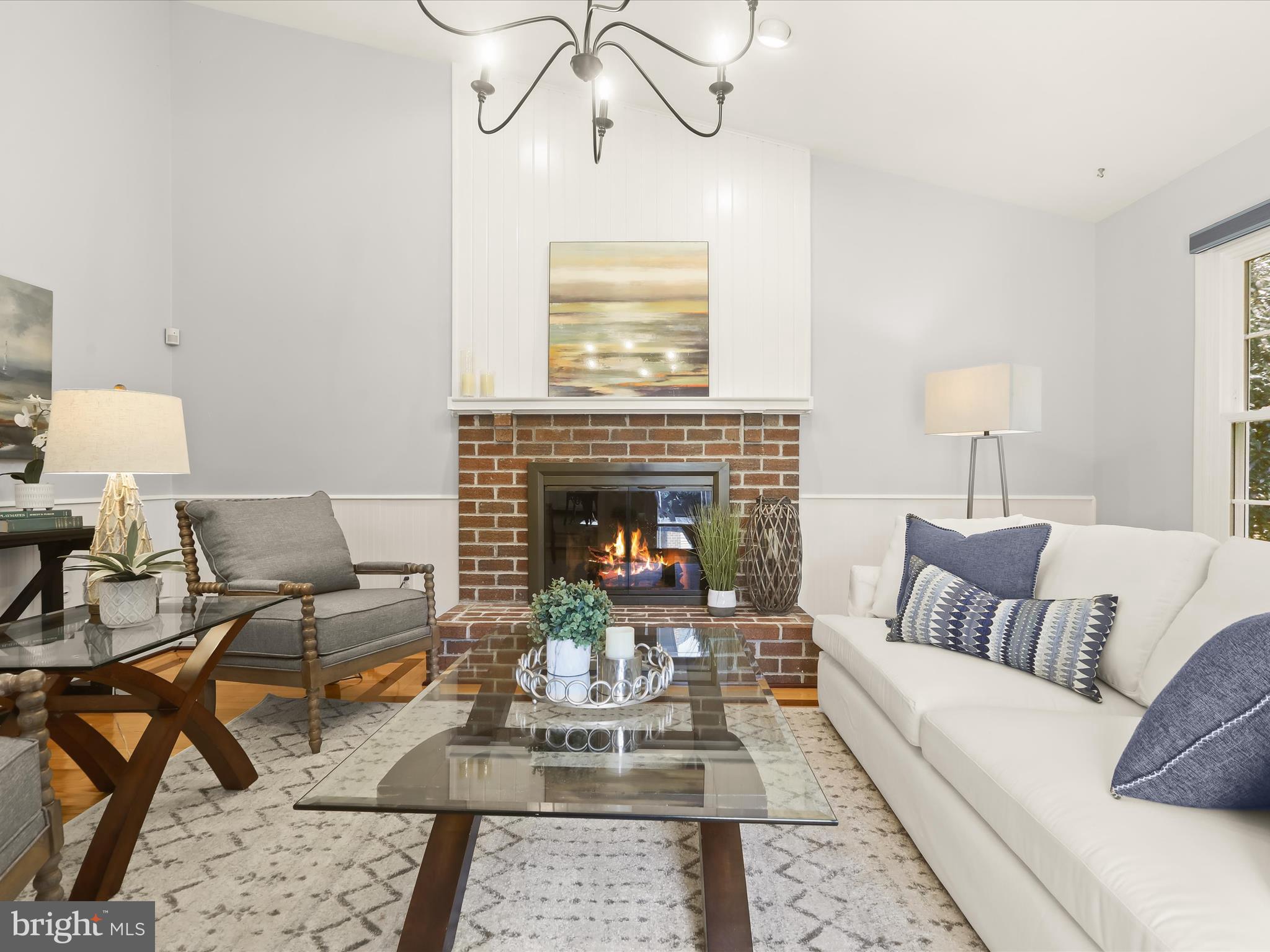 303 Riding Ridge Road Annapolis, MD 21403 - Photo 6 of 43 a living room with furniture and a fireplace