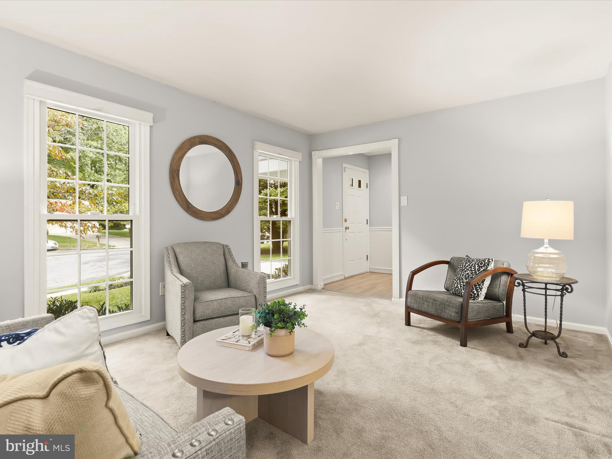 303 Riding Ridge Road Annapolis, MD 21403 - Photo 8 of 43 a living room with furniture a window and a potted plants