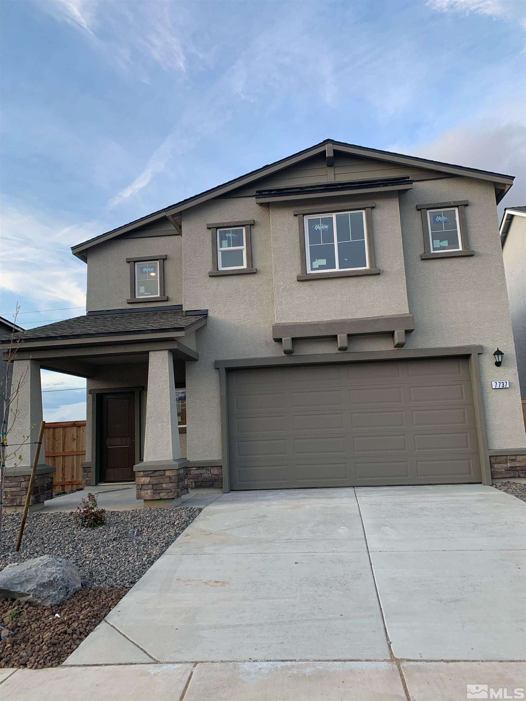 a front view of a house with yard