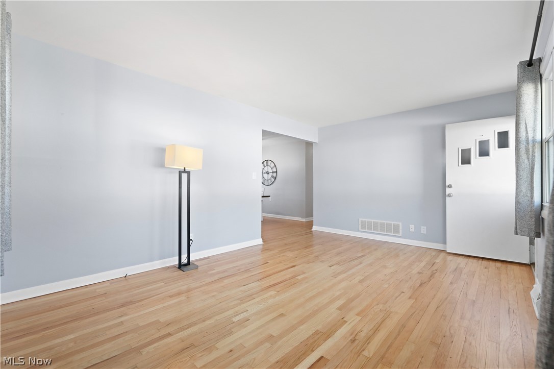 4003 Kenneth Road Stow, OH 44224 - Photo 7 of 50 Empty room featuring light wood-style flooring and baseboards