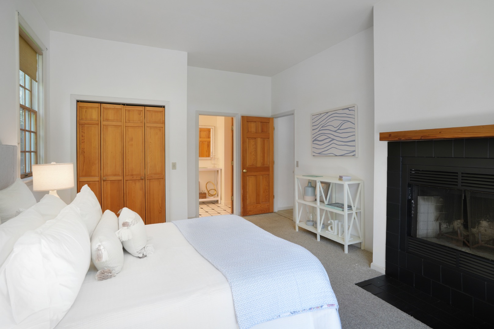 2 Cosmos Way Edgartown, MA 02539 - Photo 17 of 29 a bedroom with a bed and a fireplace