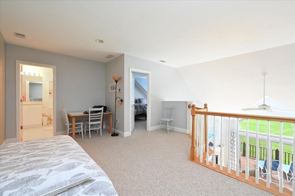 9 Prestwick Road, Unit 9 Bourne, MA 02532 - Photo 15 of 30 a bedroom with furniture and a window