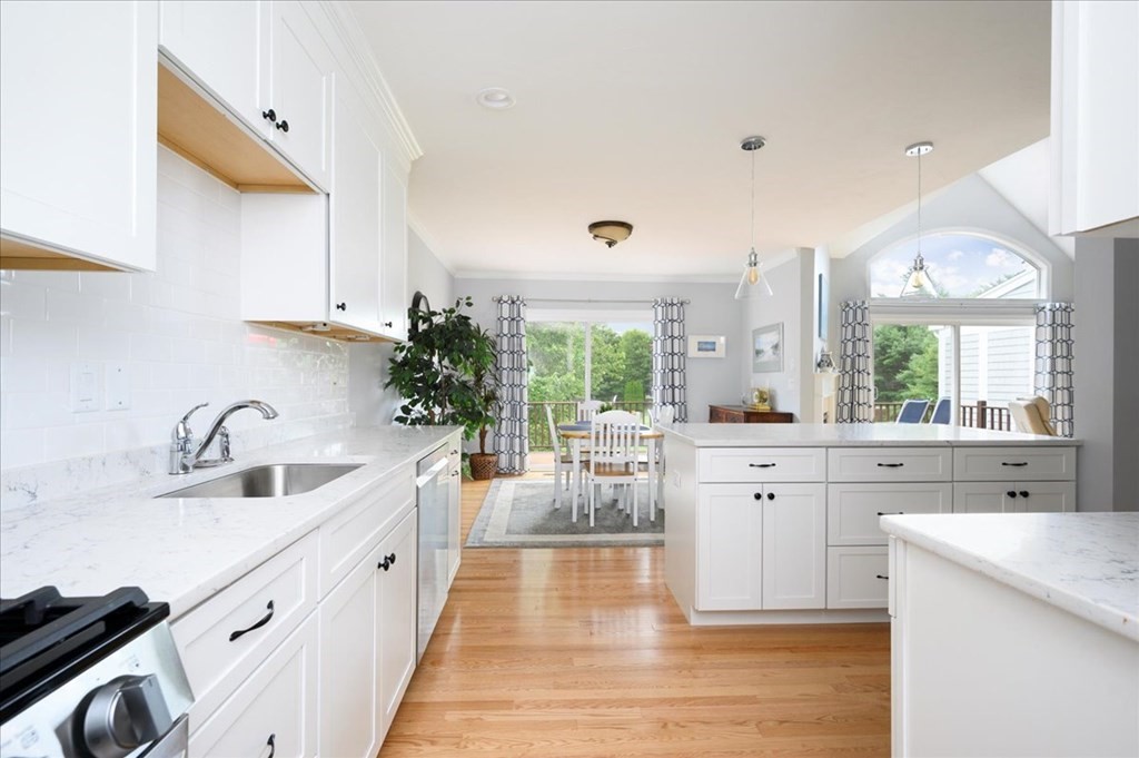 9 Prestwick Road, Unit 9 Bourne, MA 02532 - Photo 9 of 30 a large white kitchen with a large window