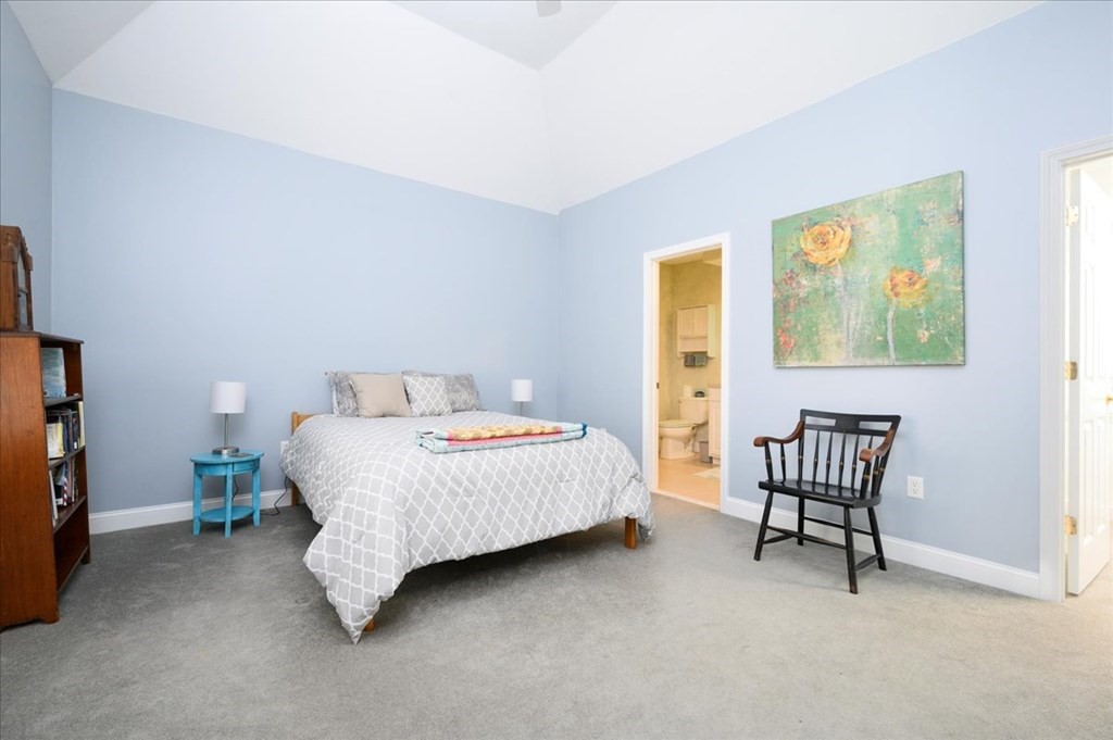 9 Prestwick Road, Unit 9 Bourne, MA 02532 - Photo 10 of 30 a bedroom with a bed chair and window