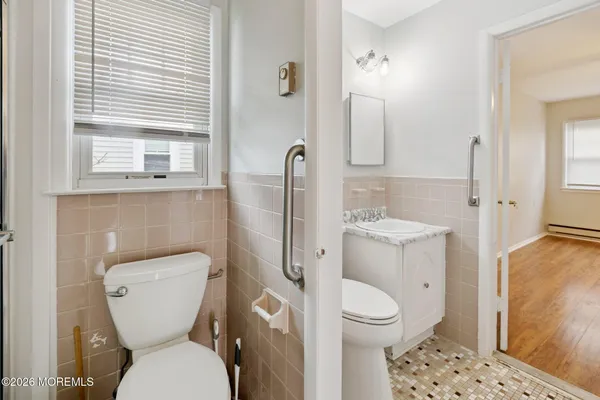 a bathroom with a toilet and a sink