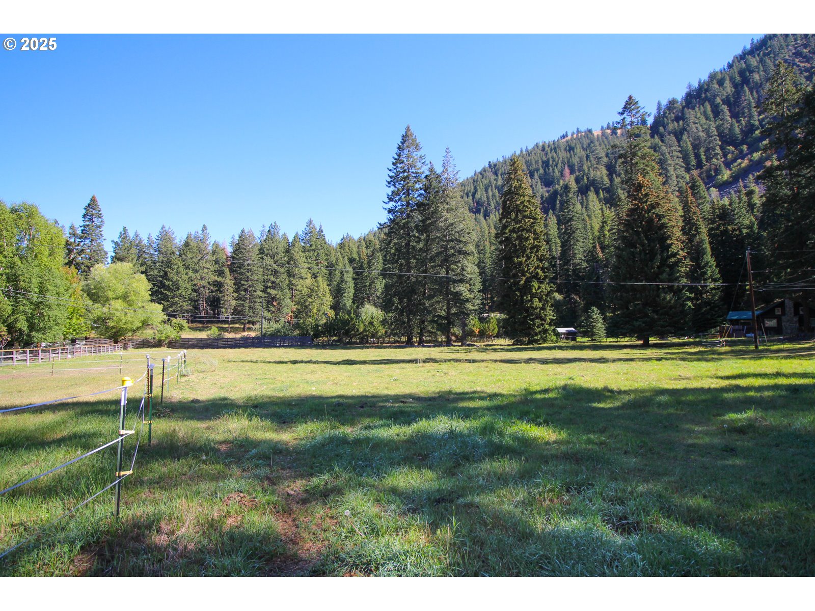 Meadow Lane Joseph, OR 97846 - Photo 4 of 10 a swimming pool with wooden fence