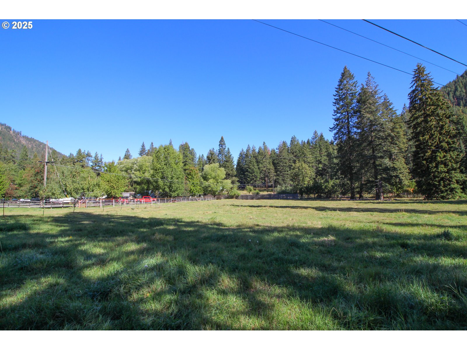 Meadow Lane Joseph, OR 97846 - Photo 5 of 10 a open field with trees in the background