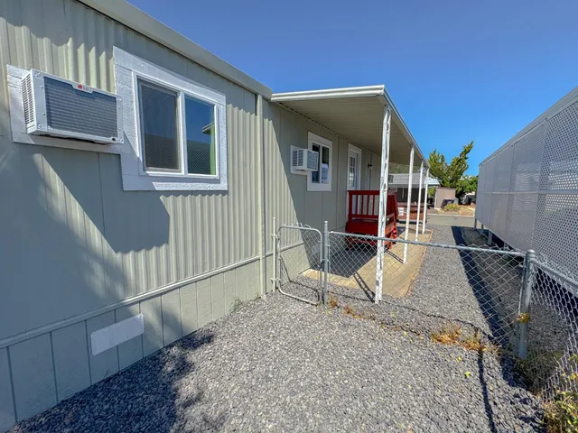 a room with furniture a washer and dryer