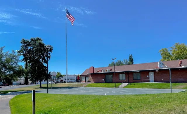 a room with pool table and window