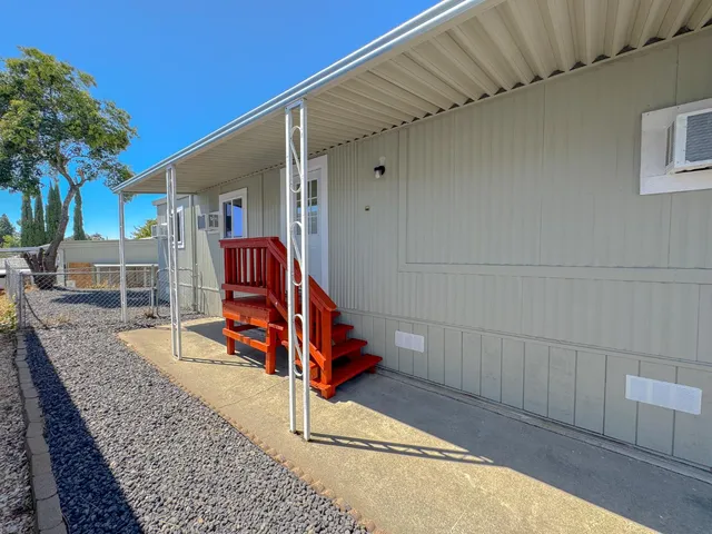 a view of a backyard with a deck