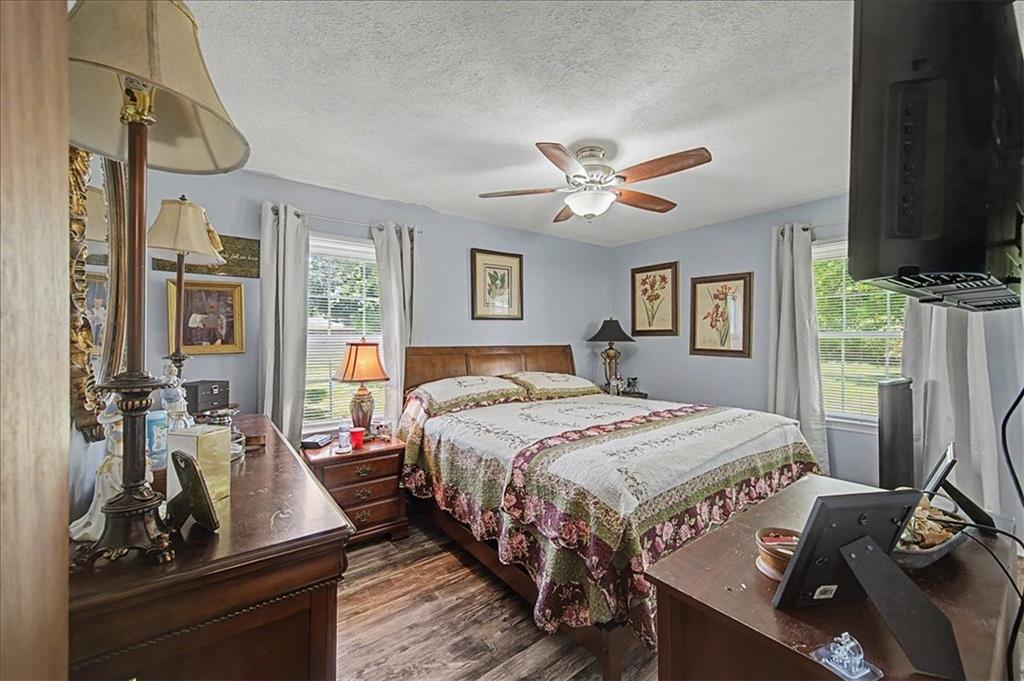 71 North Avery Road Northwest Rome, GA 30165 - Photo 22 of 42 a bedroom with a bed next to a window with kitchen view