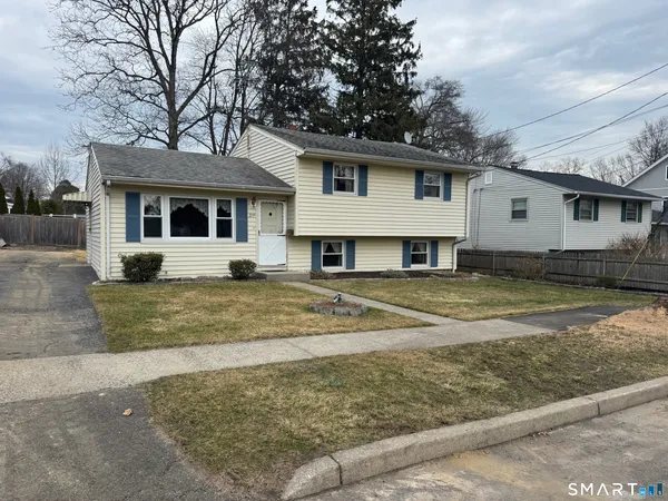 front view of a house with a yard