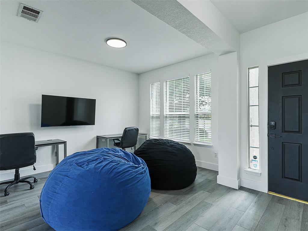 6229 Bear Run Road The Colony, TX 75056 - Photo 13 of 25 a bedroom with bed and a flat screen tv