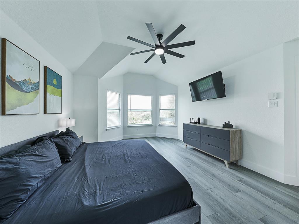 6229 Bear Run Road The Colony, TX 75056 - Photo 16 of 25 a bed room with a bed window and a television