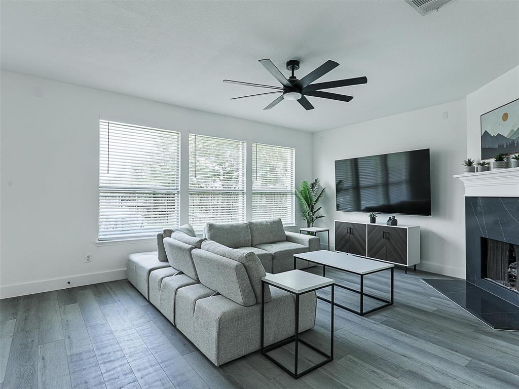 6229 Bear Run Road The Colony, TX 75056 - Photo 17 of 25 a living room with furniture and a flat screen tv