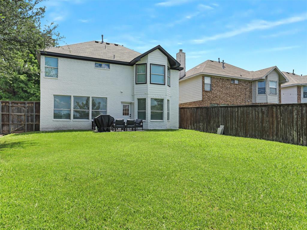 6229 Bear Run Road The Colony, TX 75056 - Photo 19 of 25 a front view of a house with a garden