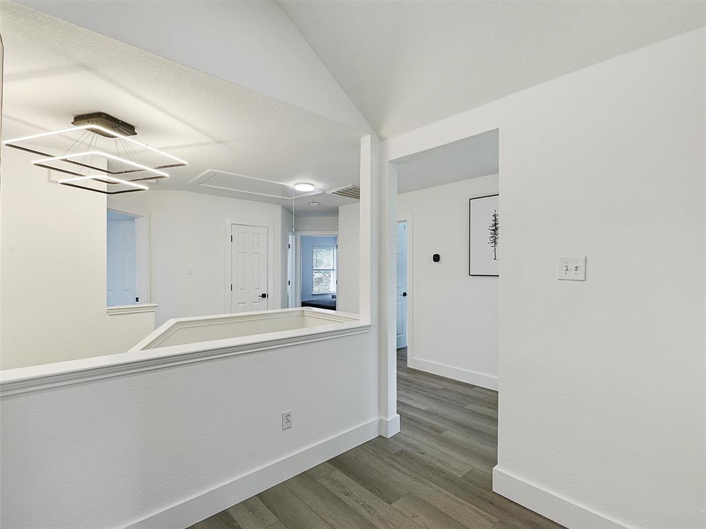6229 Bear Run Road The Colony, TX 75056 - Photo 22 of 25 a view of a kitchen with wooden floor