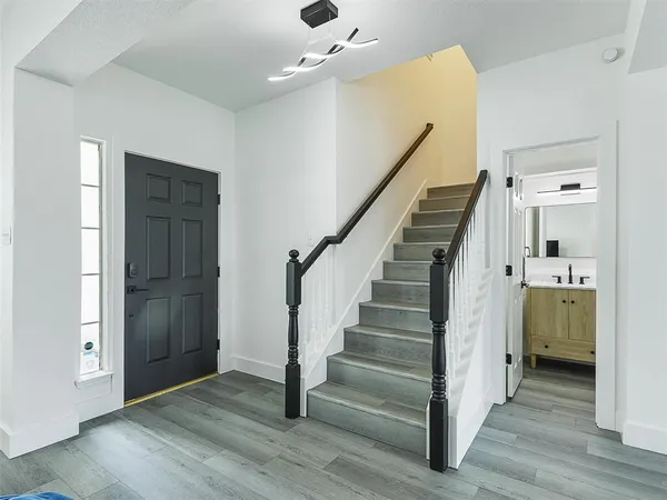a view of entryway with wooden floor