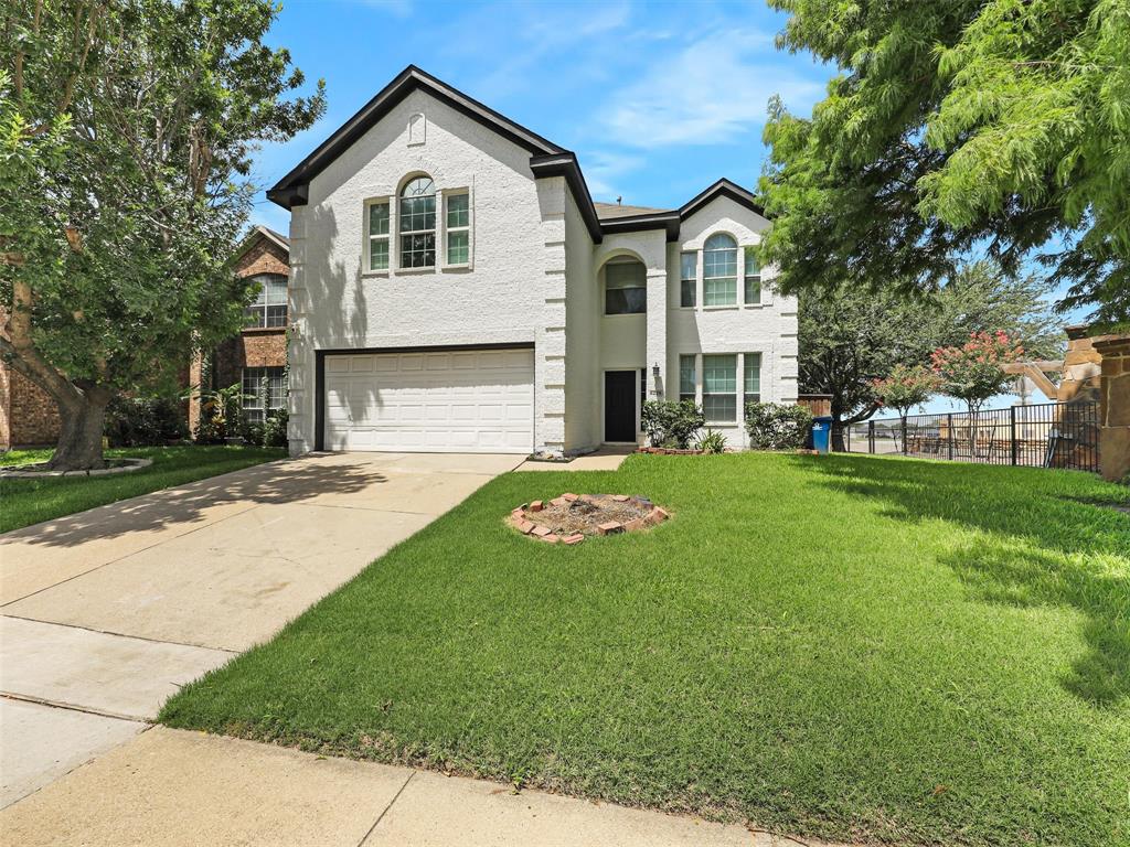 6229 Bear Run Road The Colony, TX 75056 - Photo 4 of 25 a front view of a house with a yard