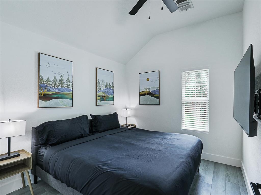 6229 Bear Run Road The Colony, TX 75056 - Photo 10 of 25 a bedroom with a bed and a window