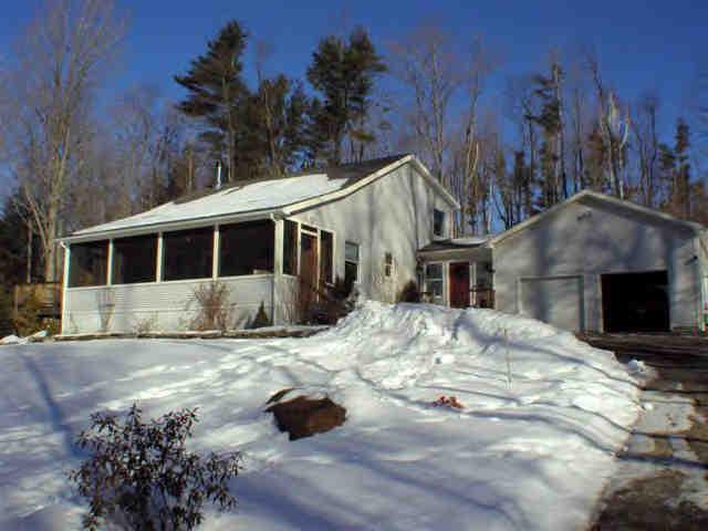 112 Hammertown Road Sandisfield, MA 01255 - Photo 1 of 8 a view of a house with snow on the side of the road