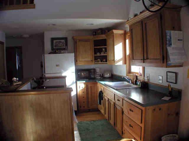 112 Hammertown Road Sandisfield, MA 01255 - Photo 5 of 8 a kitchen with stainless steel appliances granite countertop a sink stove and cabinets