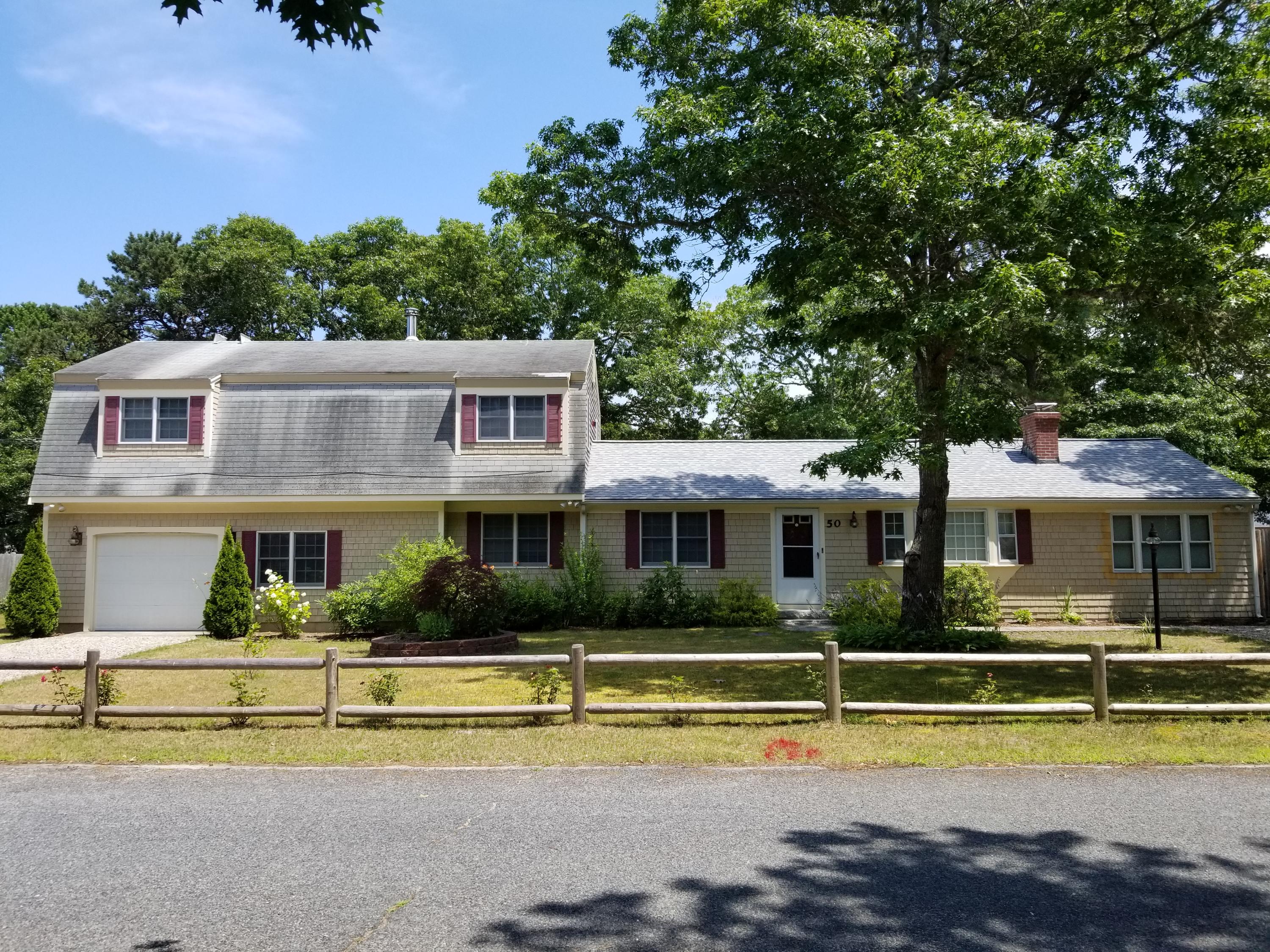 50 Nearmeadows Road West Yarmouth, MA 02673 - Photo 1 of 20 a front view of a house with a swimming pool