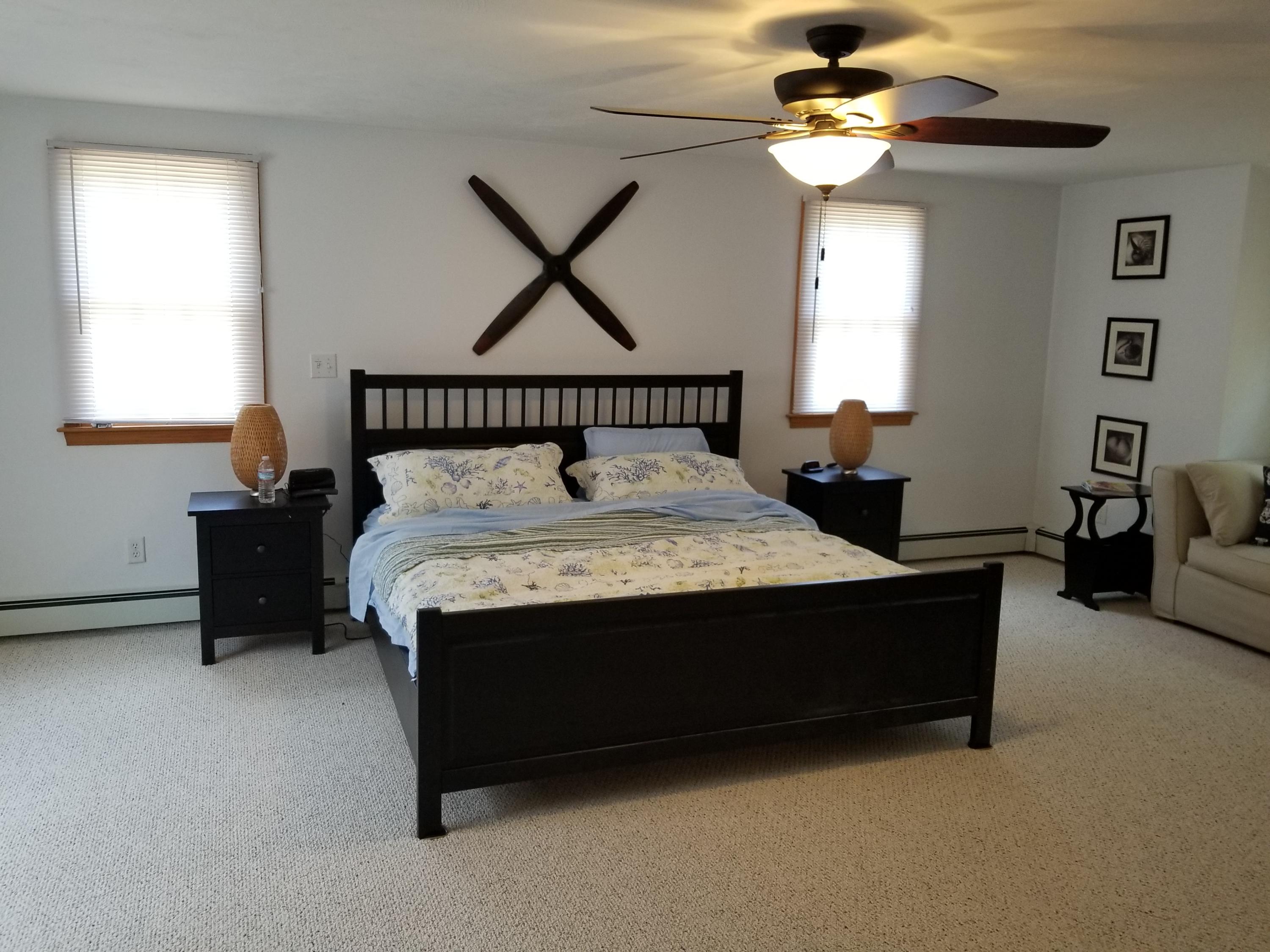 50 Nearmeadows Road West Yarmouth, MA 02673 - Photo 14 of 20 a bed sitting in a bedroom next to a window