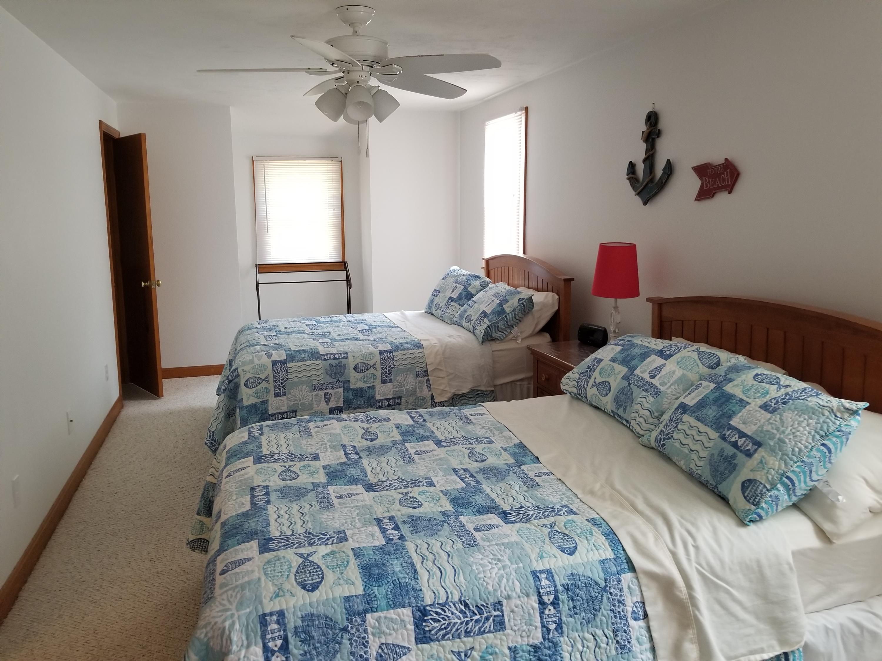 50 Nearmeadows Road West Yarmouth, MA 02673 - Photo 18 of 20 a bedroom with two beds and a window