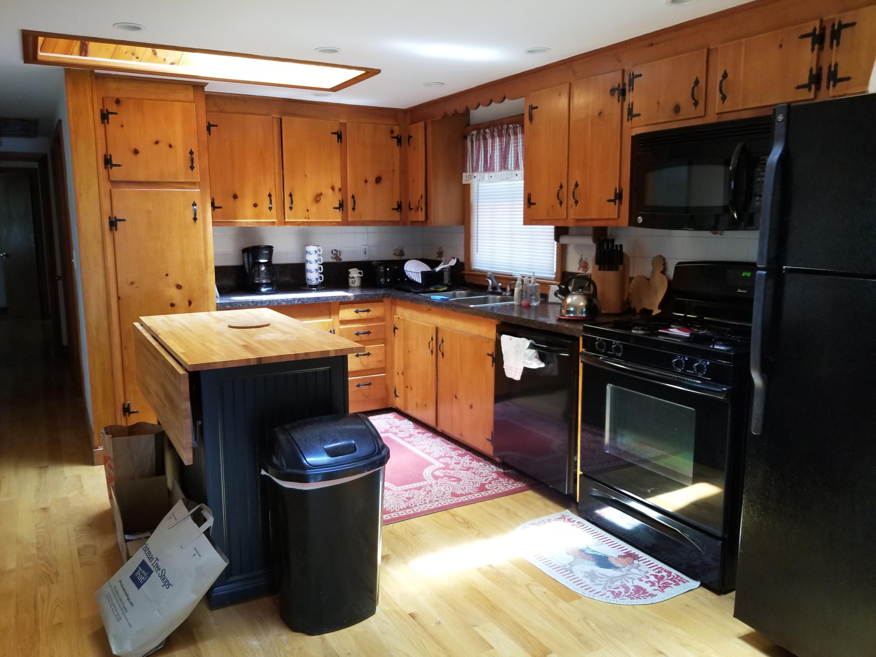 50 Nearmeadows Road West Yarmouth, MA 02673 - Photo 6 of 20 a kitchen with a refrigerator stove and a sink