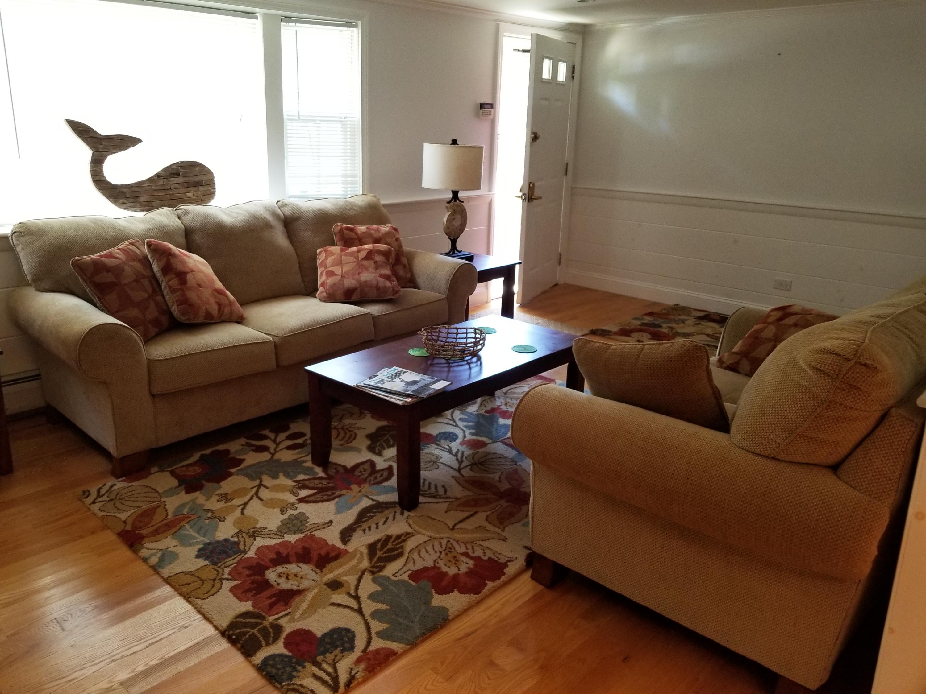 50 Nearmeadows Road West Yarmouth, MA 02673 - Photo 8 of 20 a living room with furniture and a rug