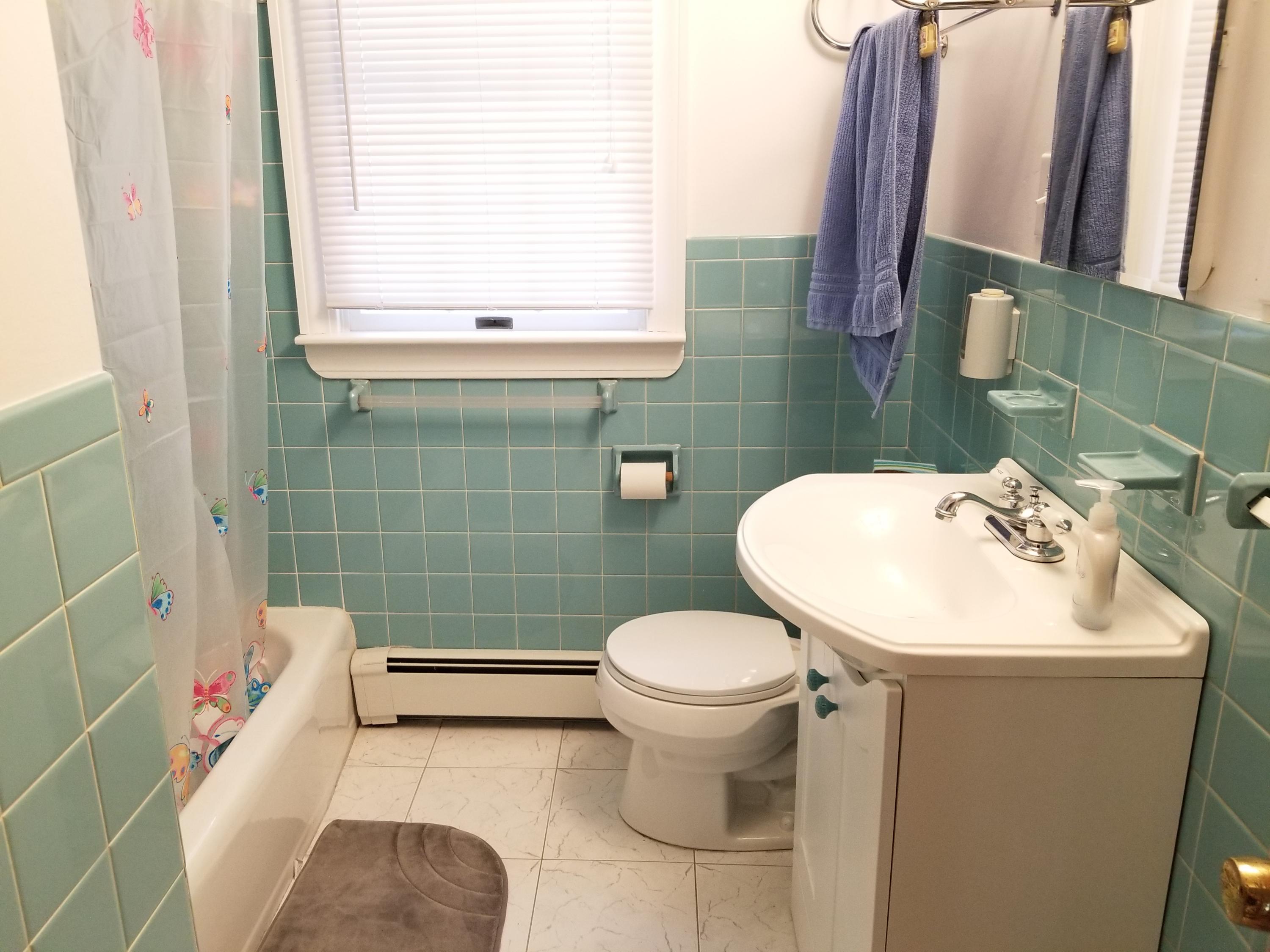 50 Nearmeadows Road West Yarmouth, MA 02673 - Photo 9 of 20 a bathroom with a sink toilet and shower