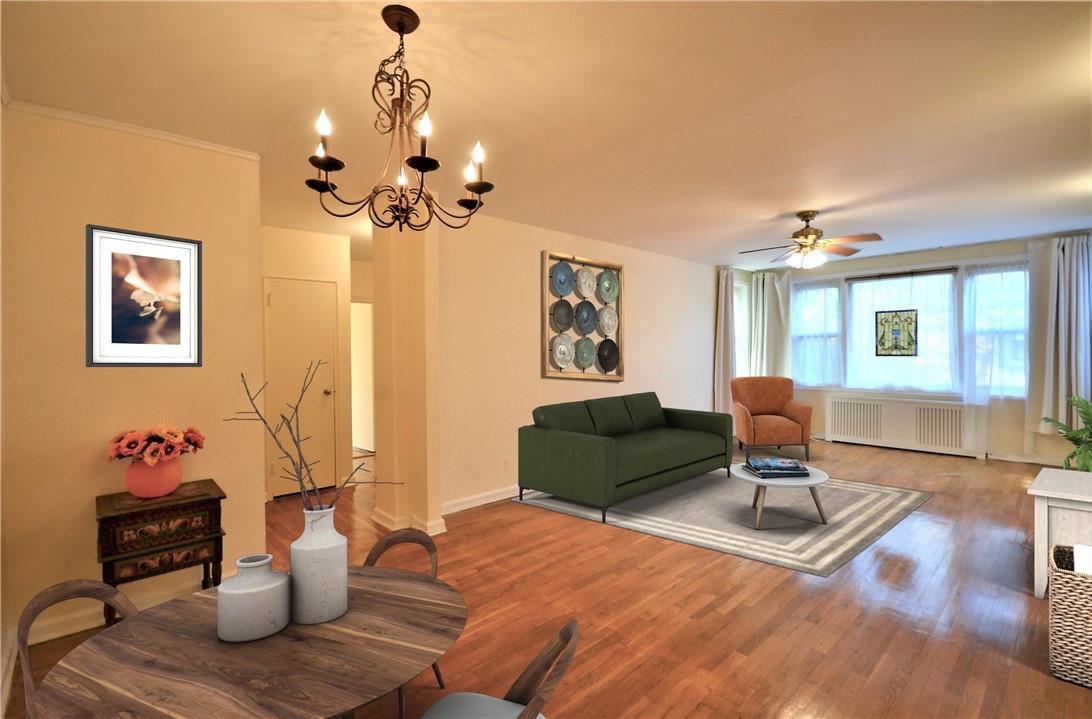 a living room with furniture flowerpot and window