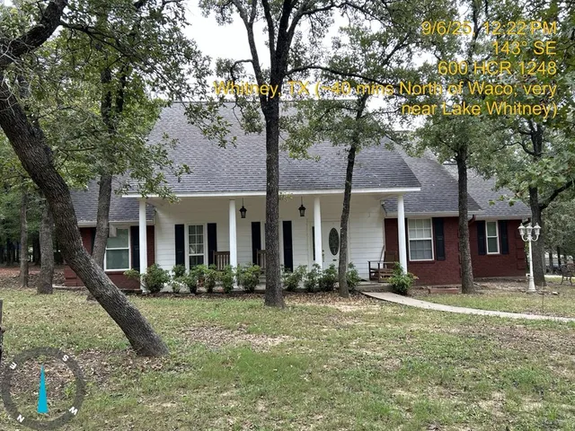 a front view of a house with yard porch