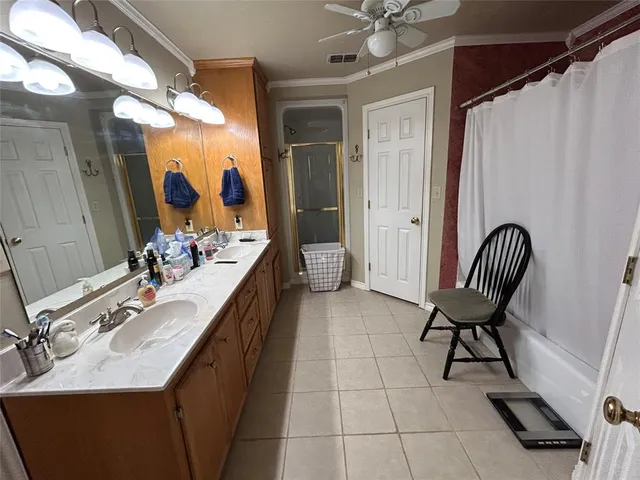 a bathroom with a sink vanity and a mirror