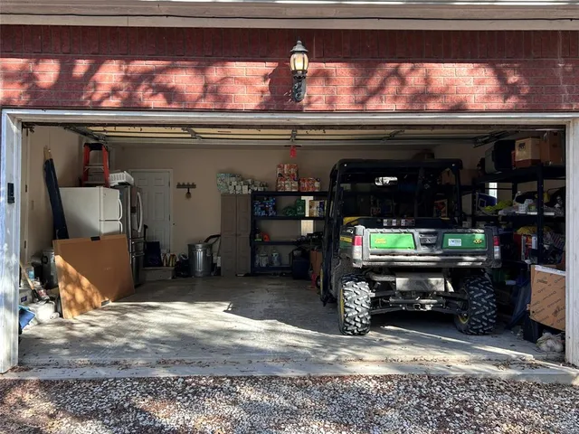 a fire hydrant in middle of a forest