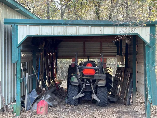 a backyard of a house with yard barbeque oven and outdoor seating