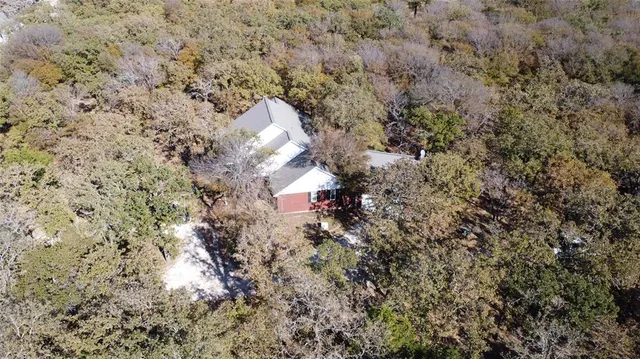 an aerial view of house with yard