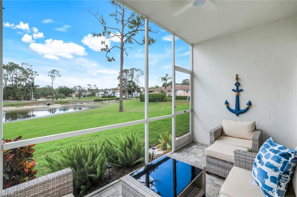 555 Augusta Boulevard, Unit 31 Naples, FL 34113 - Photo 15 of 17 Sunroom with a water view and ceiling fan