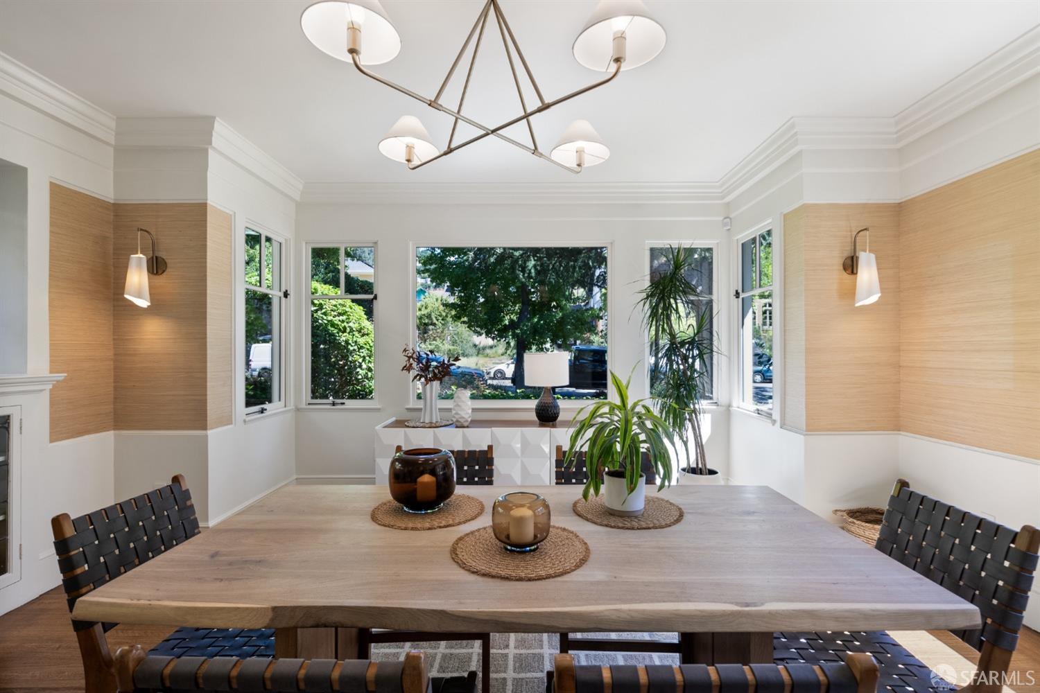 2728 Claremont Boulevard Berkeley, CA 94705 - Photo 15 of 55 a dining room with furniture a large window and potted plants